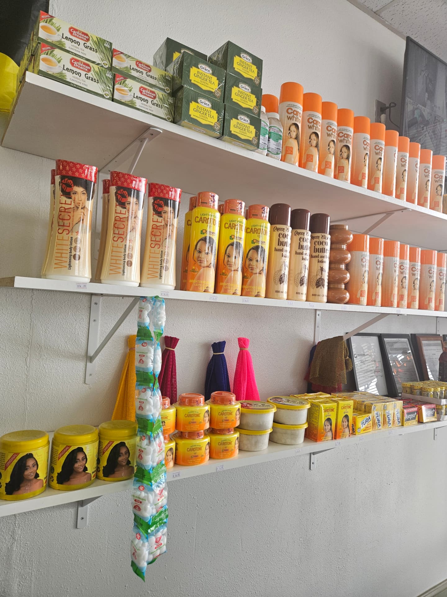Beauty shelf with body lotions, cocoa butter and herbal teas