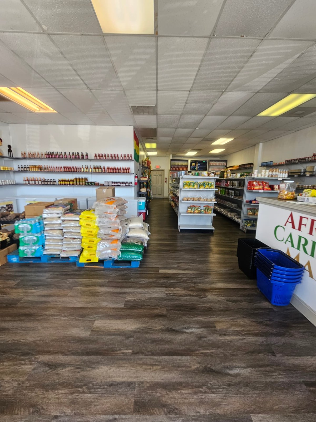 The family behind Atonsu Royal African Caribbean Food Market at their Houston store counter